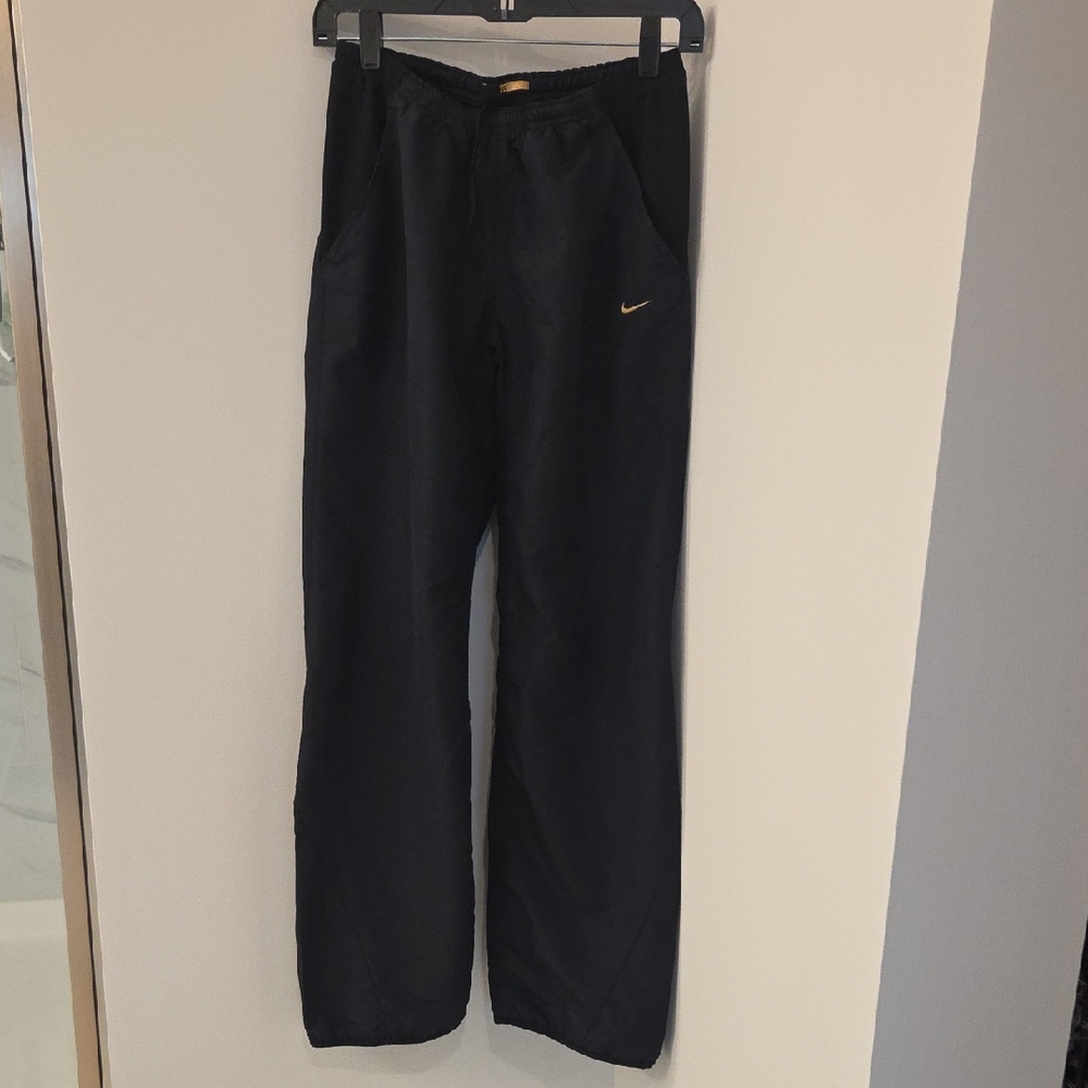 Nike Sphere Dry Women's Black Joggers with Gold Logo